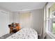 Cozy bedroom with a window view and a classic wooden desk, providing a peaceful retreat at 2610 S Sheridan Ave, Indianapolis, IN 46203