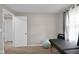 Simple bedroom with an open doorway and a massage table, offering a tranquil space at 2610 S Sheridan Ave, Indianapolis, IN 46203