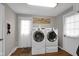 Efficient laundry room with modern front-loading washer and dryer, optimizing laundry tasks at 2610 S Sheridan Ave, Indianapolis, IN 46203