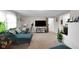 Cozy living room featuring modern furniture, a large TV, and ample space for relaxation at 2610 S Sheridan Ave, Indianapolis, IN 46203