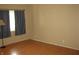 Bedroom featuring a light-wood floor, neutral wall paint, and a window with curtains at 3510 Maura Ct, Indianapolis, IN 46235