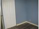 This bedroom offers a neutral color palette with closet and plank flooring at 3510 Maura Ct, Indianapolis, IN 46235