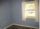 Neutral bedroom with window letting in natural light and light colored curtains at 3510 Maura Ct, Indianapolis, IN 46235