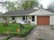 Charming ranch-style home featuring a well-maintained lawn and a cozy front porch area at 3510 Maura Ct, Indianapolis, IN 46235