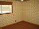 Room featuring a window and patterned wallpaper at 3510 Maura Ct, Indianapolis, IN 46235