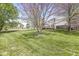 Large backyard with manicured lawn, deck, and privacy fence at 3582 Fieldhurst Ln, Plainfield, IN 46168