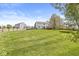 Spacious backyard with manicured lawn and a wood fence at 3582 Fieldhurst Ln, Plainfield, IN 46168