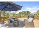 Inviting backyard deck with outdoor seating, a fire pit, and a grill, ideal for relaxing and entertaining at 3582 Fieldhurst Ln, Plainfield, IN 46168