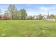Expansive backyard featuring a lush green lawn and charming wooden fence, perfect for outdoor activities at 3582 Fieldhurst Ln, Plainfield, IN 46168