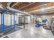 This is an unfinished basement with exposed ductwork and weightlifting equipment at 3582 Fieldhurst Ln, Plainfield, IN 46168