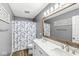 Bathroom featuring double sinks and a shower with a blue floral curtain at 3582 Fieldhurst Ln, Plainfield, IN 46168