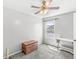 This bedroom features a ceiling fan, carpet flooring, neutral paint, and a window at 3582 Fieldhurst Ln, Plainfield, IN 46168