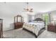 Spacious bedroom features a large bed, ceiling fan, and ample natural light from the windows at 3582 Fieldhurst Ln, Plainfield, IN 46168