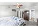 Bedroom features a ceiling fan, soft carpet, and a closet for ample storage space at 3582 Fieldhurst Ln, Plainfield, IN 46168