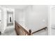 This hallway features carpet flooring and a wooden banister at 3582 Fieldhurst Ln, Plainfield, IN 46168