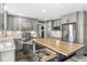 Spacious kitchen featuring an island with a butcher block countertop, stainless steel appliances, and ample storage space at 3582 Fieldhurst Ln, Plainfield, IN 46168