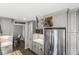 Contemporary kitchen with stainless steel appliances, gray cabinets, and a convenient pull-down spice rack and microwave at 3582 Fieldhurst Ln, Plainfield, IN 46168