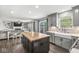 Bright kitchen featuring a butcher block island, farmhouse sink, stainless steel dishwasher, and easy access to the living room at 3582 Fieldhurst Ln, Plainfield, IN 46168
