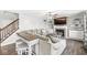 Cozy living room with a fireplace, built-in shelves, and staircase access at 3582 Fieldhurst Ln, Plainfield, IN 46168