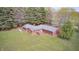 Aerial shot of well-maintained brick home featuring a large, manicured lawn at 3913 E Cr 600 S, Clayton, IN 46118