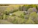 Overhead view of home with adjacent outbuilding surrounded by spring foliage at 3913 E Cr 600 S, Clayton, IN 46118