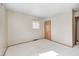 Bedroom featuring soft, neutral walls, white carpet, wood trim, and a window with natural light at 3913 E Cr 600 S, Clayton, IN 46118