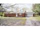 Charming red brick ranch style home with attached garage and mature shade trees at 3913 E Cr 600 S, Clayton, IN 46118