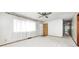 Bright living room with a ceiling fan, plush carpeting, and a window, offering a cozy atmosphere at 3913 E Cr 600 S, Clayton, IN 46118
