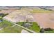 Aerial view showing the house on a well-manicured green lawn surrounded by expansive farmland at 4155 S State Rd 39, Lebanon, IN 46052