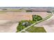Panoramic aerial shot capturing a quaint home amidst a blend of green lawns and farmland at 4155 S State Rd 39, Lebanon, IN 46052