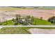 Breathtaking aerial view capturing the property with surrounding mature trees and farmlands at 4155 S State Rd 39, Lebanon, IN 46052