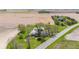 Expansive aerial view of a well-kept home surrounded by vibrant green lawn and open fields at 4155 S State Rd 39, Lebanon, IN 46052