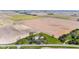 Scenic aerial view showcasing the home and surrounding farmland in a peaceful setting at 4155 S State Rd 39, Lebanon, IN 46052