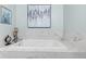Bathroom showcasing a large tub with marble accents and modern fixtures at 4155 S State Rd 39, Lebanon, IN 46052