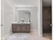 Bathroom with a double vanity, large mirror, and a luxurious tiled shower at 4155 S State Rd 39, Lebanon, IN 46052