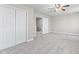 Spacious carpeted bedroom with a ceiling fan and double door closet at 4155 S State Rd 39, Lebanon, IN 46052