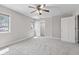Bright bedroom featuring a ceiling fan, carpeted floors, and abundant natural light at 4155 S State Rd 39, Lebanon, IN 46052
