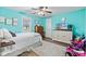 Bright bedroom with wood floors, a decorative ceiling fan, and a large window at 4155 S State Rd 39, Lebanon, IN 46052