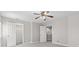 Spacious bedroom with neutral colors, plush carpeting, and ceiling fan at 4155 S State Rd 39, Lebanon, IN 46052