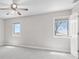 Neutral-toned bedroom featuring carpeted floors, windows, and ample sunlight at 4155 S State Rd 39, Lebanon, IN 46052