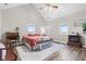 Well lit bedroom featuring a pitched ceiling, comfortable bed, and natural light at 4155 S State Rd 39, Lebanon, IN 46052