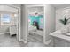 Bedroom with modern grey hardwood flooring connecting to an en-suite bathroom at 4155 S State Rd 39, Lebanon, IN 46052