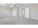 Bright, carpeted bedroom with a ceiling fan, neutral walls, and double door closet at 4155 S State Rd 39, Lebanon, IN 46052