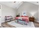 Well lit bedroom featuring a pitched ceiling, comfortable bed, and view to the outside at 4155 S State Rd 39, Lebanon, IN 46052