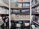 Organized closet with shelves filled with neatly packed storage bags, bins, and a vacuum cleaner at 4155 S State Rd 39, Lebanon, IN 46052