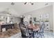 Elegant dining room featuring a wooden table, modern decor, gray walls, and wood floors at 4155 S State Rd 39, Lebanon, IN 46052