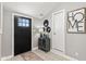 Inviting entryway featuring a black front door, gray walls, and decorative accents at 4155 S State Rd 39, Lebanon, IN 46052
