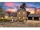 Brick home featuring an inviting outdoor patio area, an attached two-car garage, and manicured landscaping at 4155 S State Rd 39, Lebanon, IN 46052