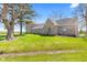 Charming two-story brick home with a spacious lawn, mature trees, and a well-maintained landscape at 4155 S State Rd 39, Lebanon, IN 46052