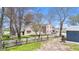 Charming brick home with a large front yard, wooden fence, and mature trees at 4155 S State Rd 39, Lebanon, IN 46052